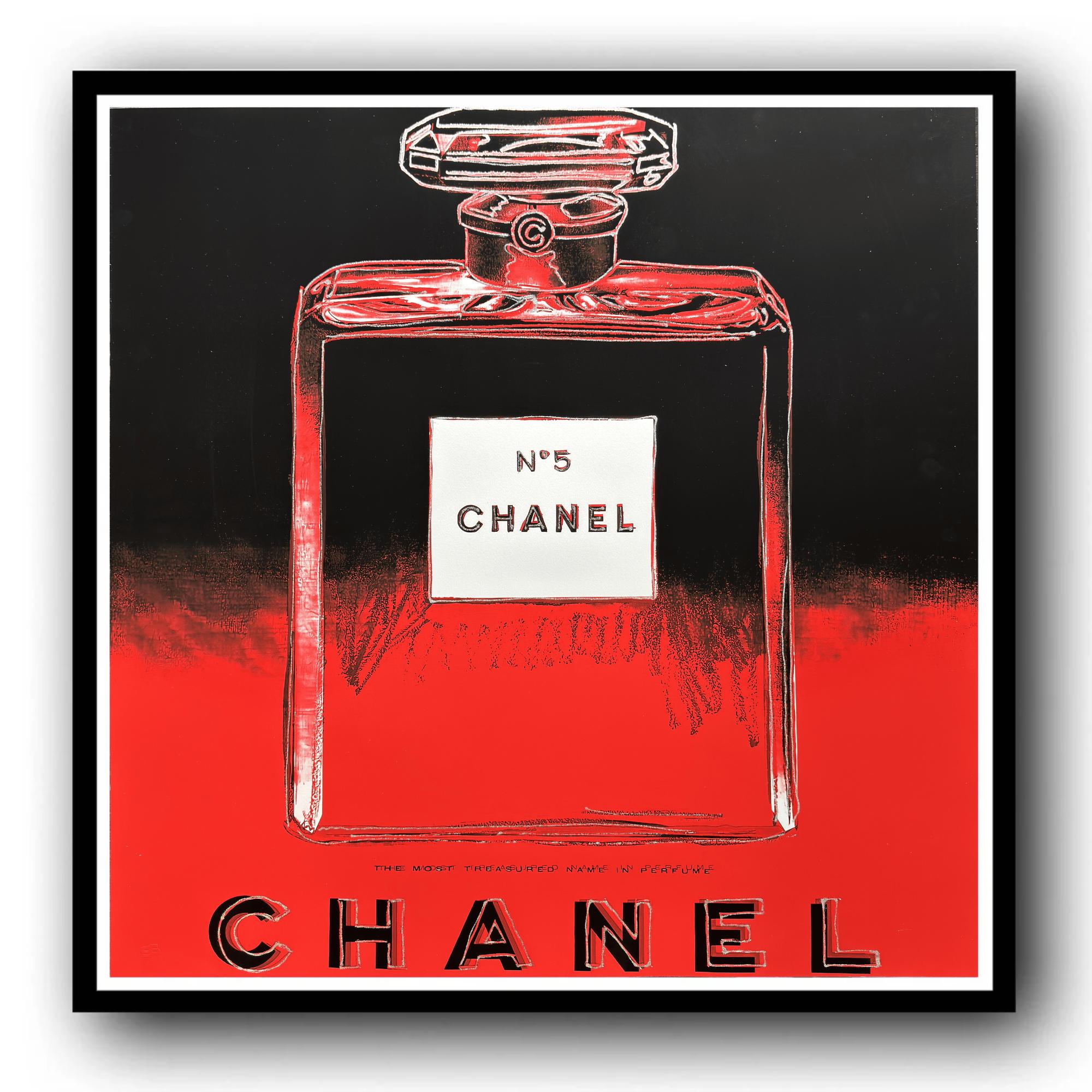 Framed artwork of a Chanel No. 5 perfume bottle on a red and black background